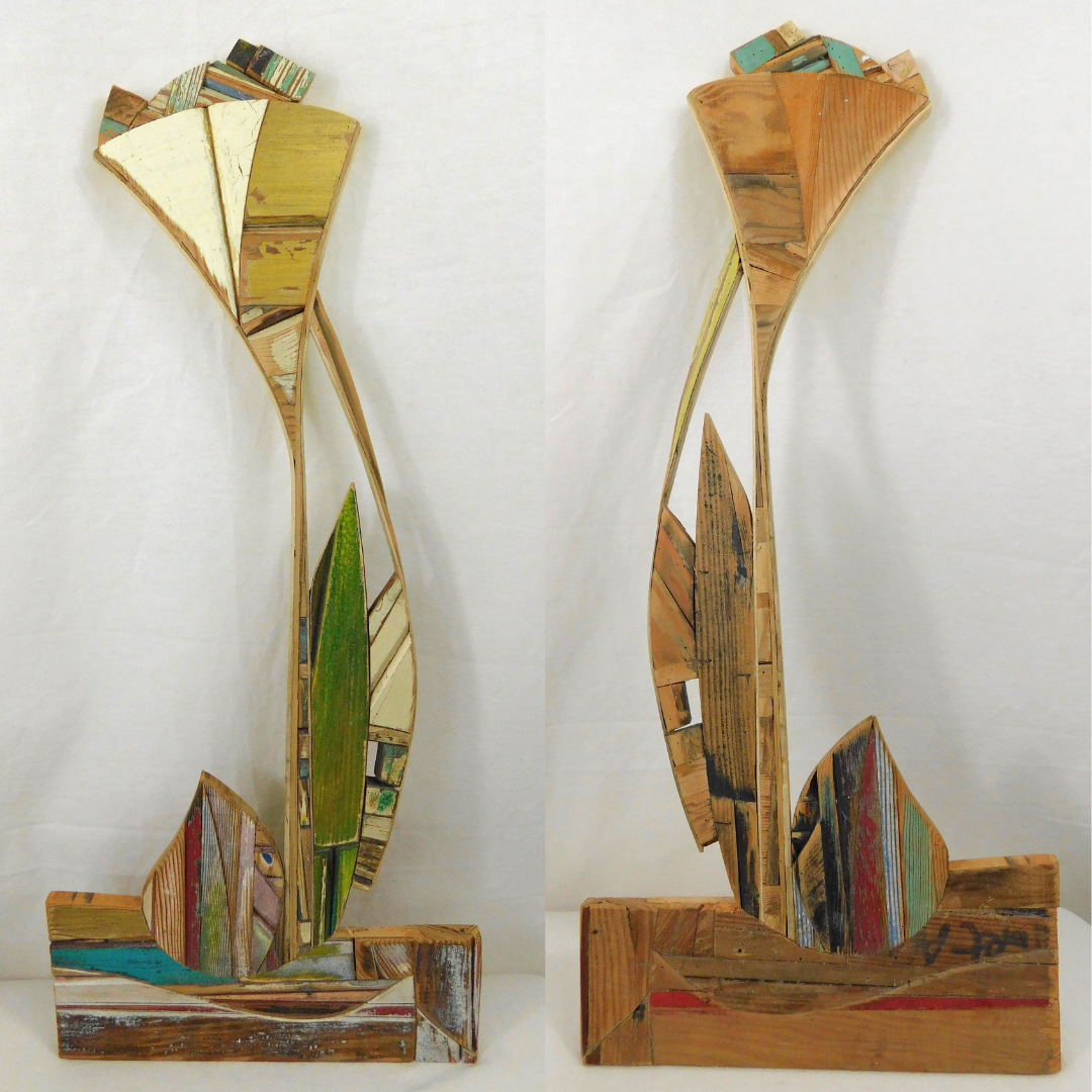 Two pictures of wooden sculpture showing front and back resembling flowers on a white background