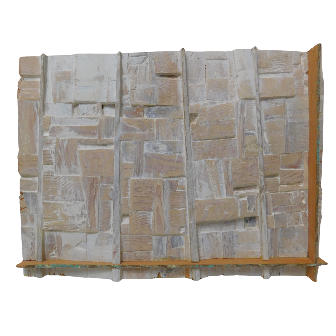 Back view of wood wall art showing a geometric pattern on a white background