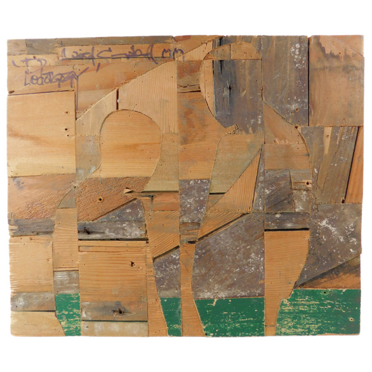 Back of artwork showing wooden pieces with a geometric pattern outline of two figures