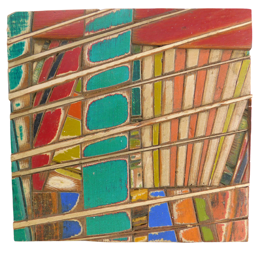 Colourful mosaic wooden art piece with geometric patterns