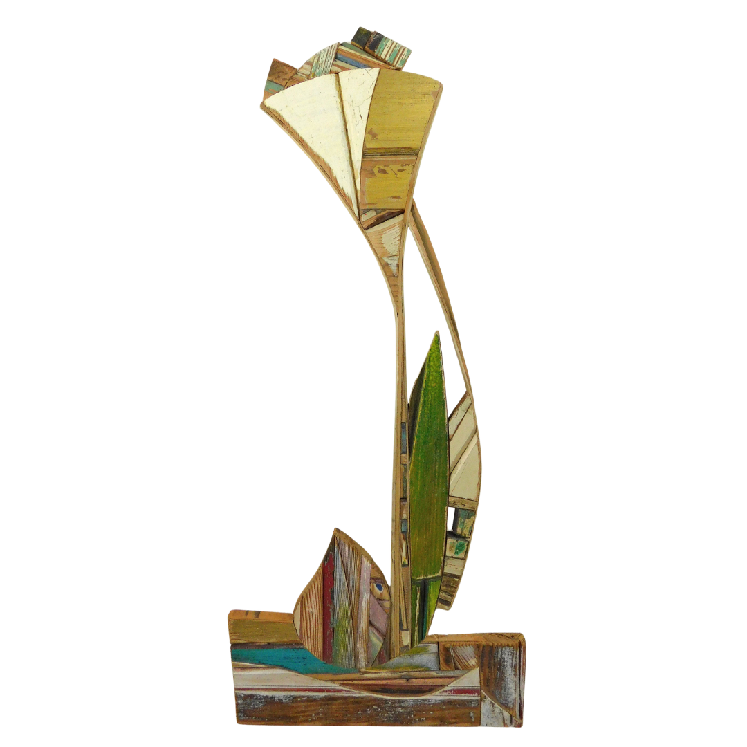Decorative wall art piece with a floral design made from recycled wood on a white background