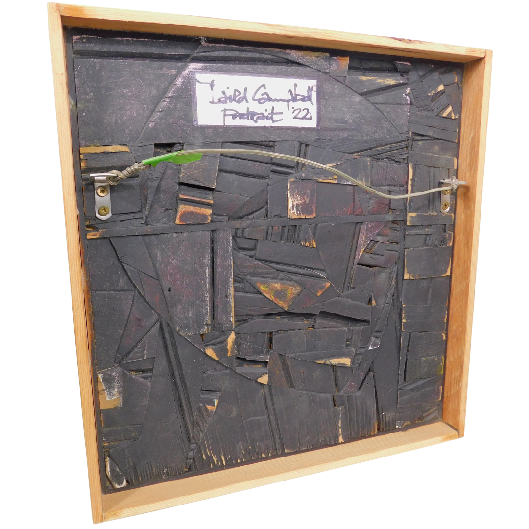 Abstract artwork back view with a wooden frame and signature on a white background