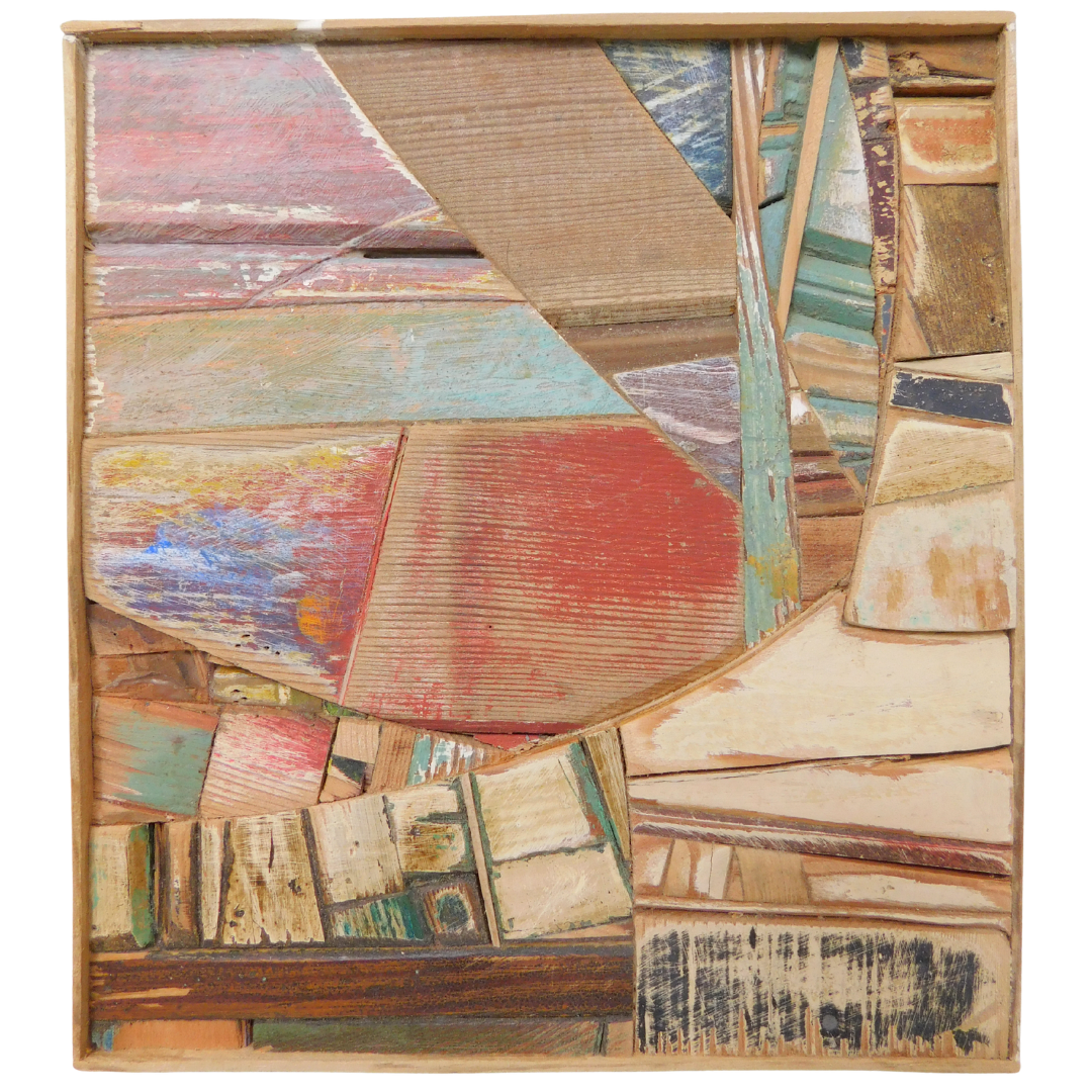 Abstract artwork with multicolored wood pieces on a white background