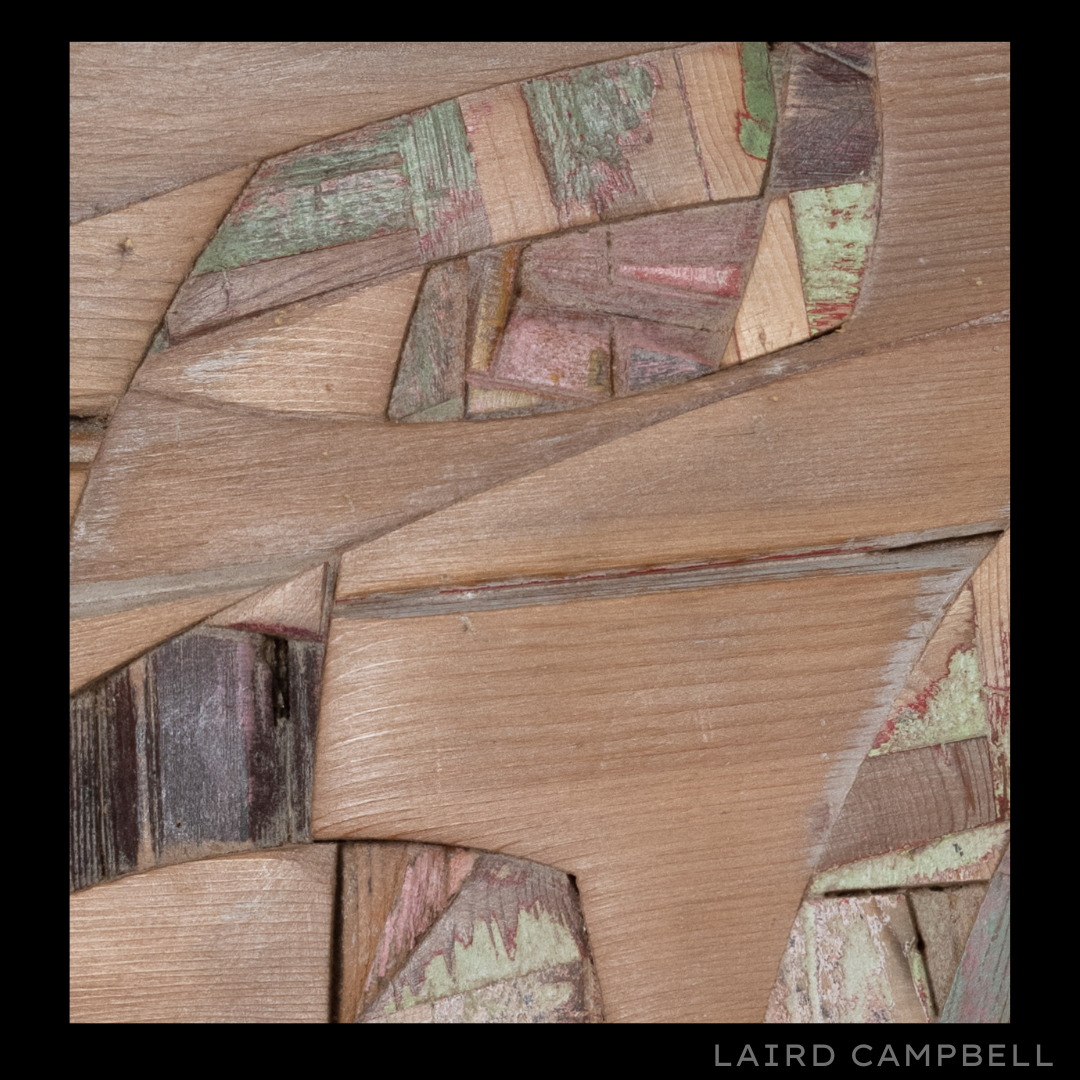 Wooden mosaic sculpture with geometric patterns, artist Laird Campbell.