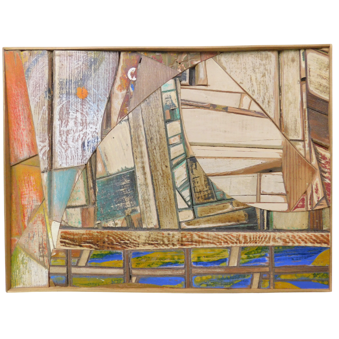 Abstract artwork with multi-colored wood pieces on a white background